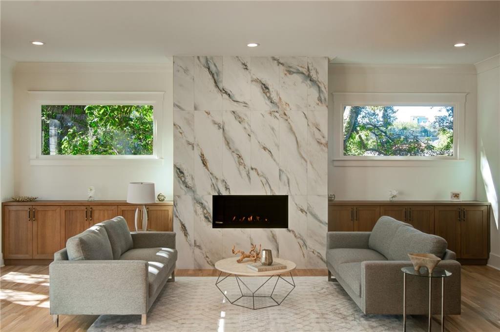 581 Sherwood Road Northeast Atlanta, GA 30324 - Photo 15 of 92 a living room with furniture a fireplace and a large window