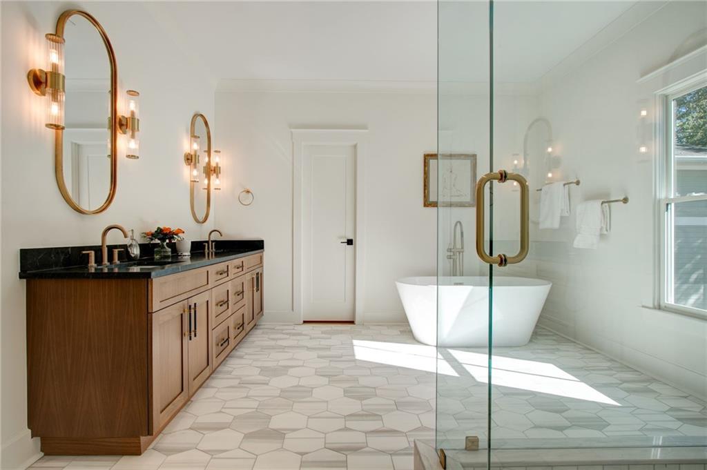 581 Sherwood Road Northeast Atlanta, GA 30324 - Photo 30 of 92 a bathroom with a double vanity sink and mirror