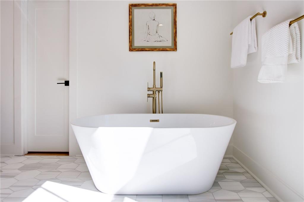 581 Sherwood Road Northeast Atlanta, GA 30324 - Photo 32 of 92 a white bath tub sitting in a bathroom