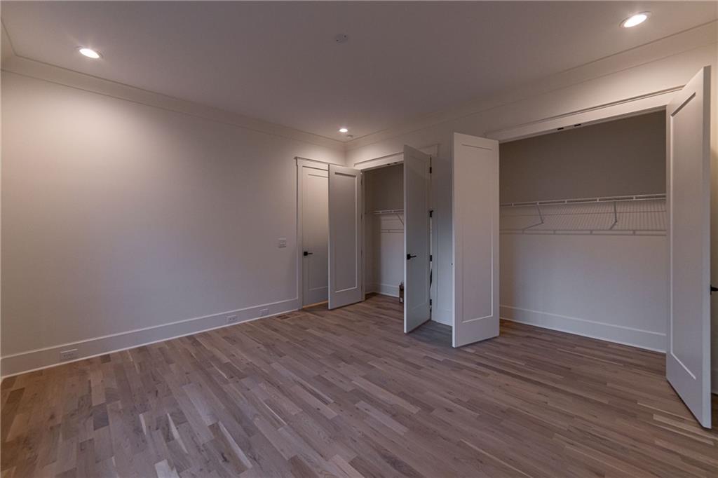 581 Sherwood Road Northeast Atlanta, GA 30324 - Photo 48 of 92 a view of an empty room with wooden floor and closet