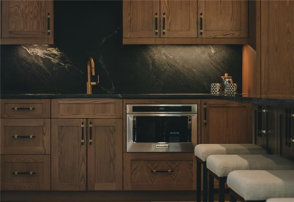 581 Sherwood Road Northeast Atlanta, GA 30324 - Photo 6 of 92 a kitchen with granite countertop cabinets and oven
