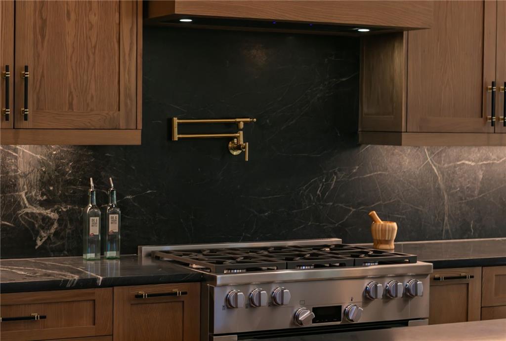 581 Sherwood Road Northeast Atlanta, GA 30324 - Photo 7 of 92 a kitchen with a stove and cabinets