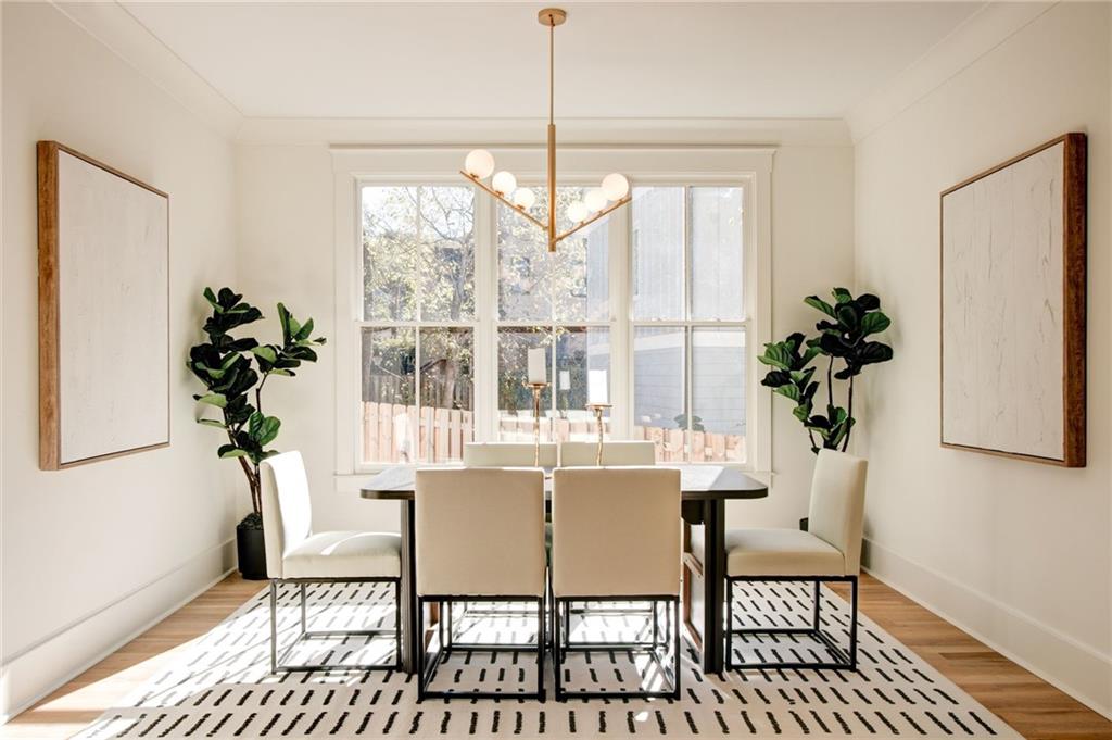 581 Sherwood Road Northeast Atlanta, GA 30324 - Photo 10 of 92 a dining room with furniture potted plants and wooden floor