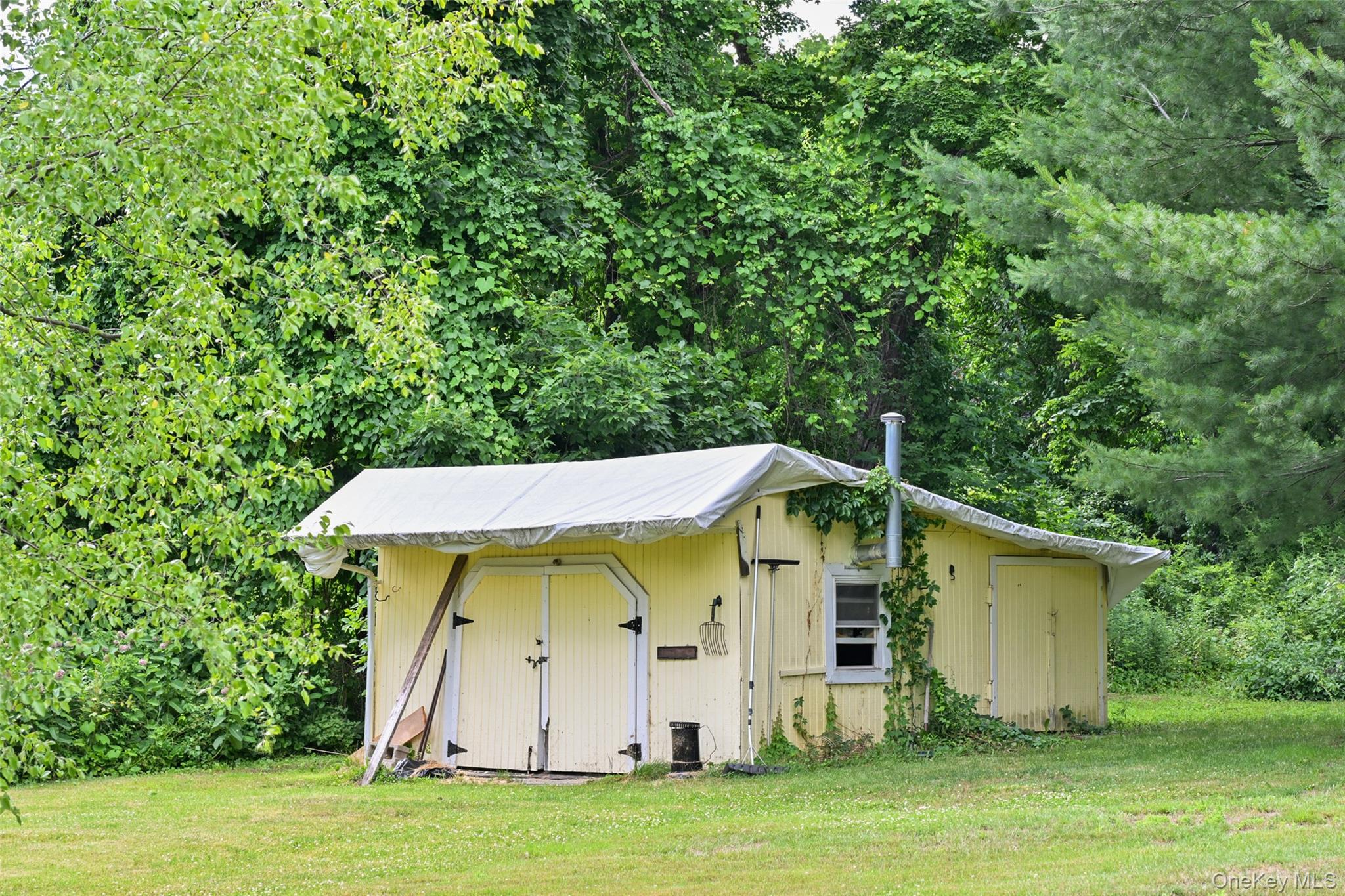 136 Foggintown Road Brewster, NY 10509 - Photo 50 of 50 a view of a wooden house with a yard