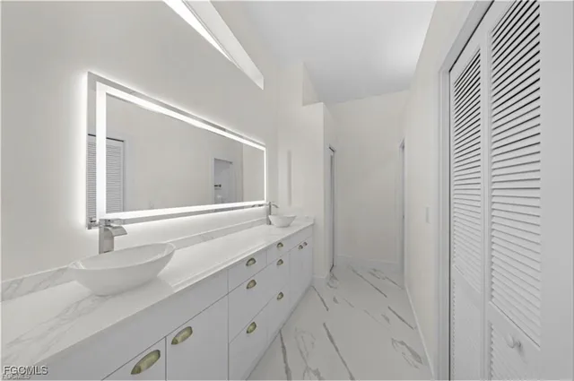 a kitchen with stainless steel appliances granite countertop a stove and a refrigerator