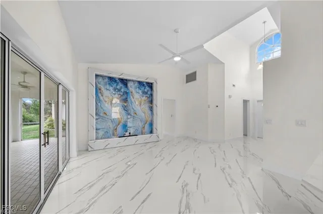 a kitchen with kitchen island a sink and stove