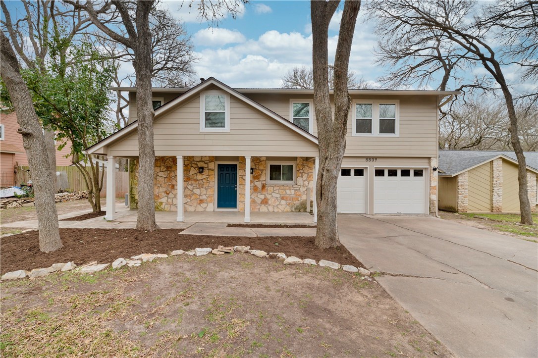 8809 Texas Sun Drive Austin, TX 78748 - Photo 1 of 1 a front view of a house with a yard and garage