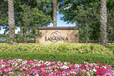 a view of a big room with kitchen view and windows