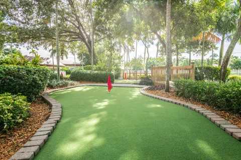 a view of a small yard and wooden fence
