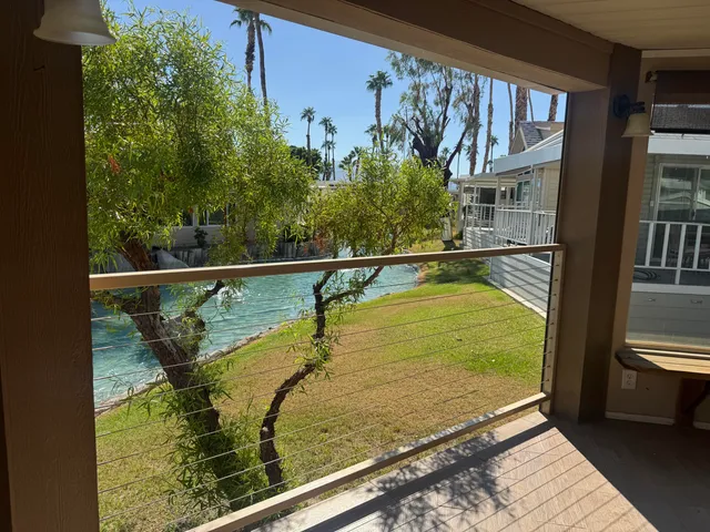 a view of swimming pool from a balcony