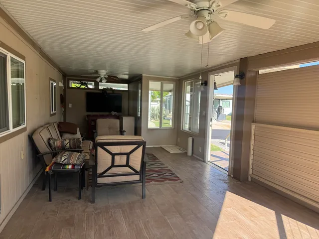 a view of a livingroom with furniture and window