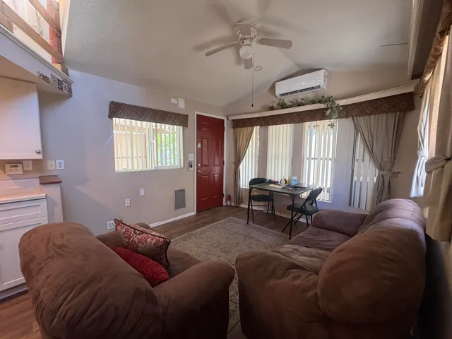 a living room with furniture and a window