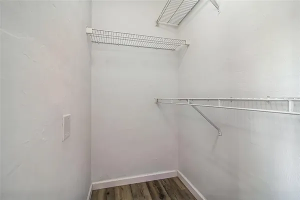 a view of a room with racks on the wall