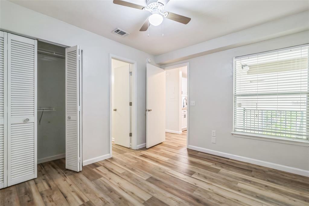 3800 Southwest 20th Avenue, Unit 112 Gainesville, FL 32607 - Photo 17 of 18 wooden floor in an empty room with a window
