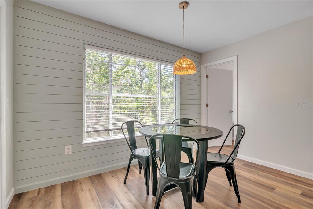 3800 Southwest 20th Avenue, Unit 112 Gainesville, FL 32607 - Photo 9 of 18 a view of a dining room with furniture window and outside view