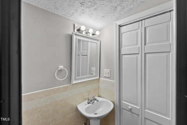 a bathroom with a glass shower door