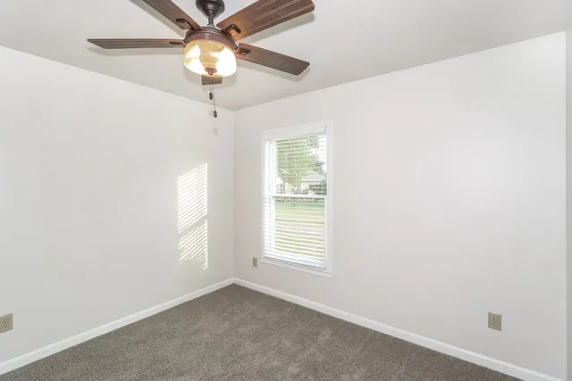 a bathroom with a tub shower and sink
