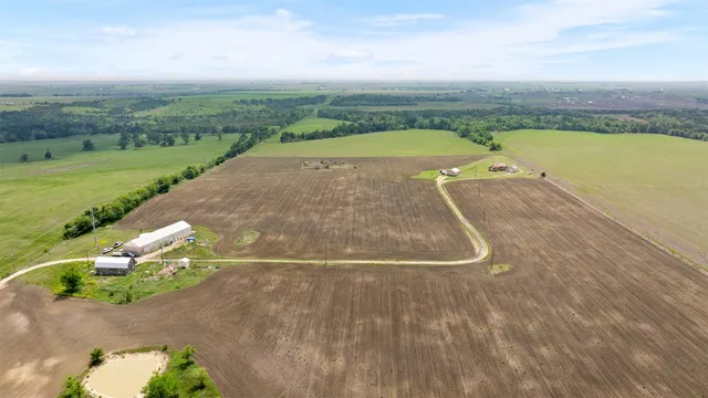 a view of a swimming pool with a yard