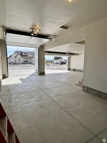 1184 West 3250 North Ogden, UT 84414 - Photo 61 of 69 Two-bay garage and fully finished walls/ceiling