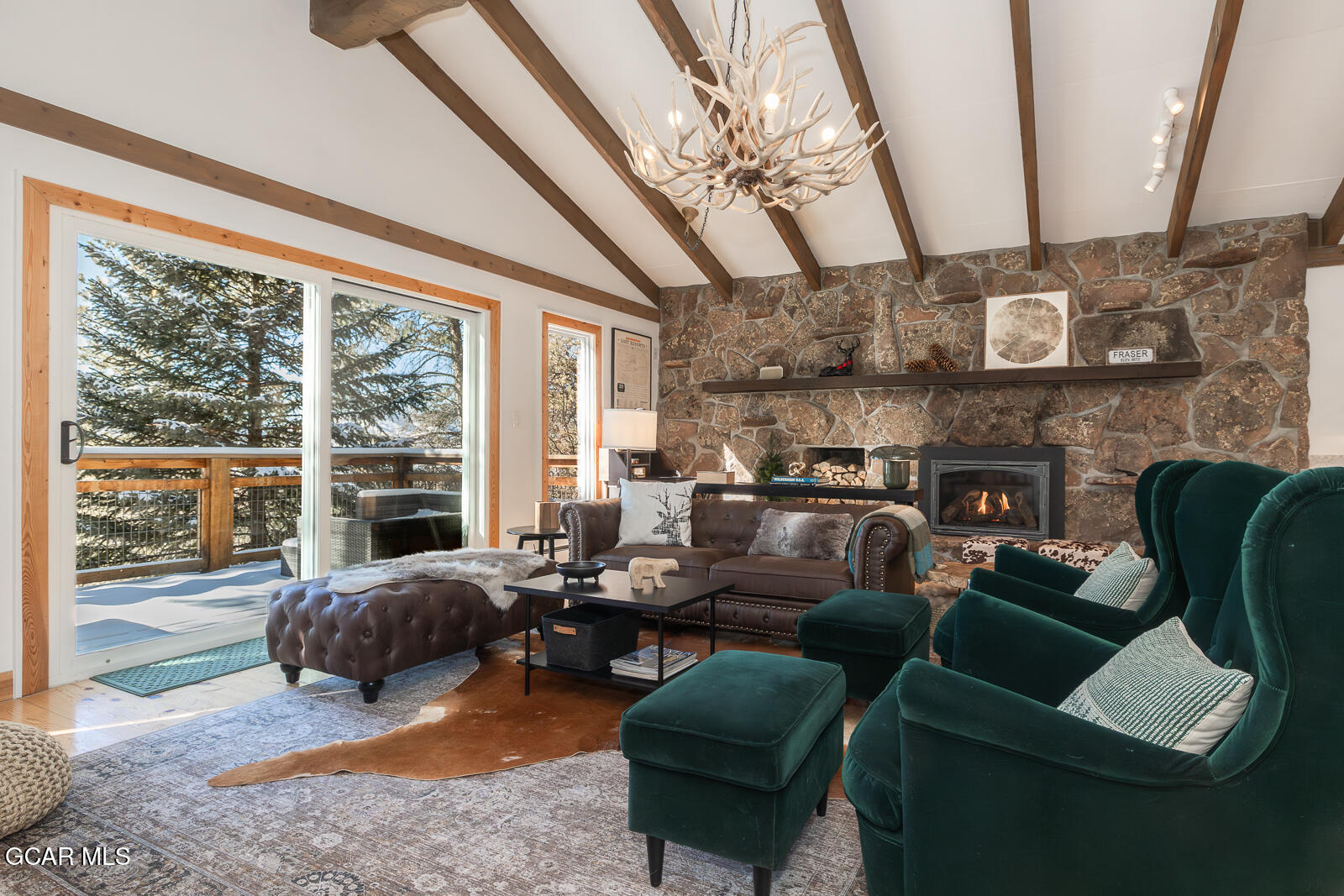 382 County Road 837 Fraser, CO 80442 - Photo 11 of 46 a living room with furniture ceiling fan and a large window