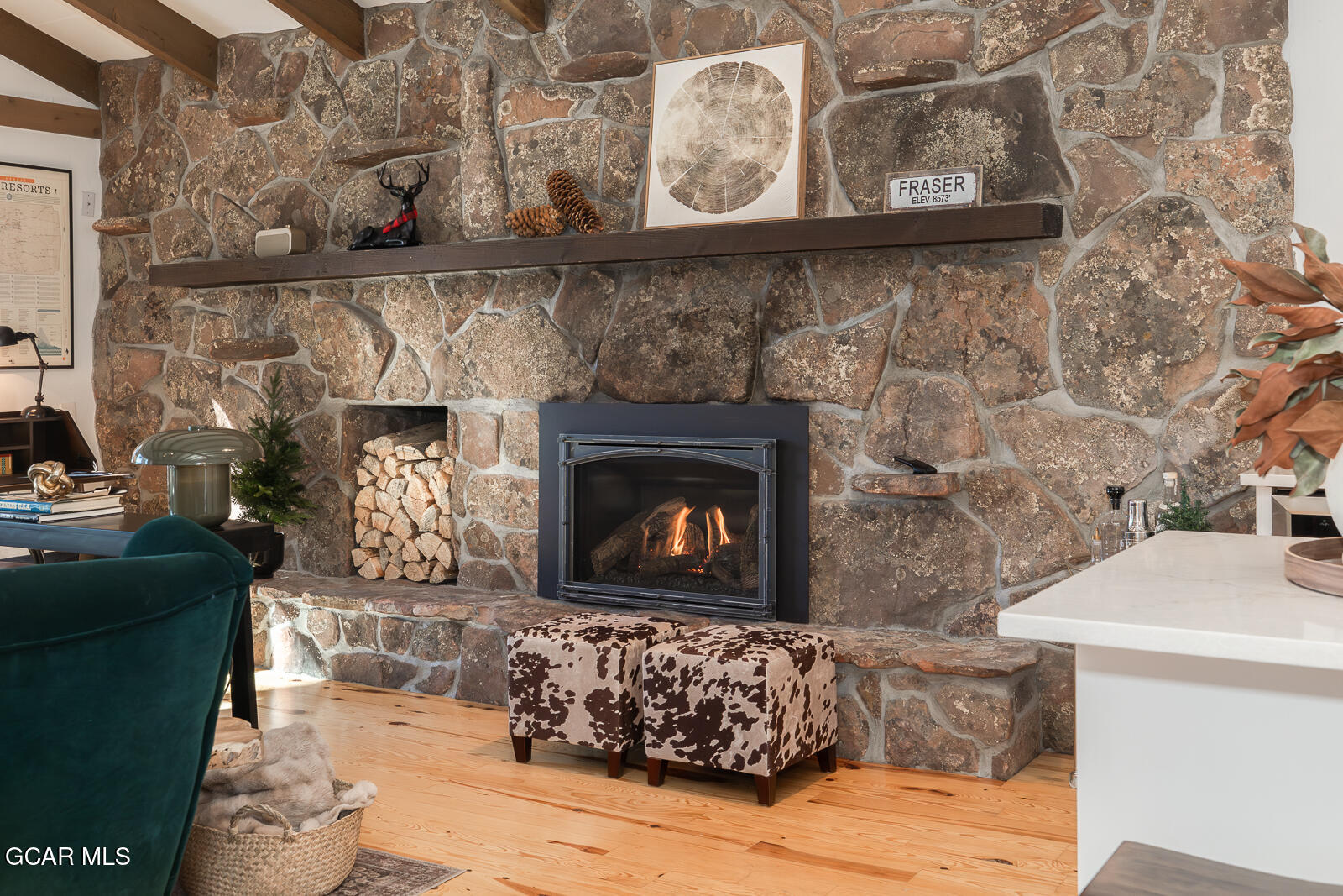 382 County Road 837 Fraser, CO 80442 - Photo 13 of 46 a living room with furniture and a fireplace