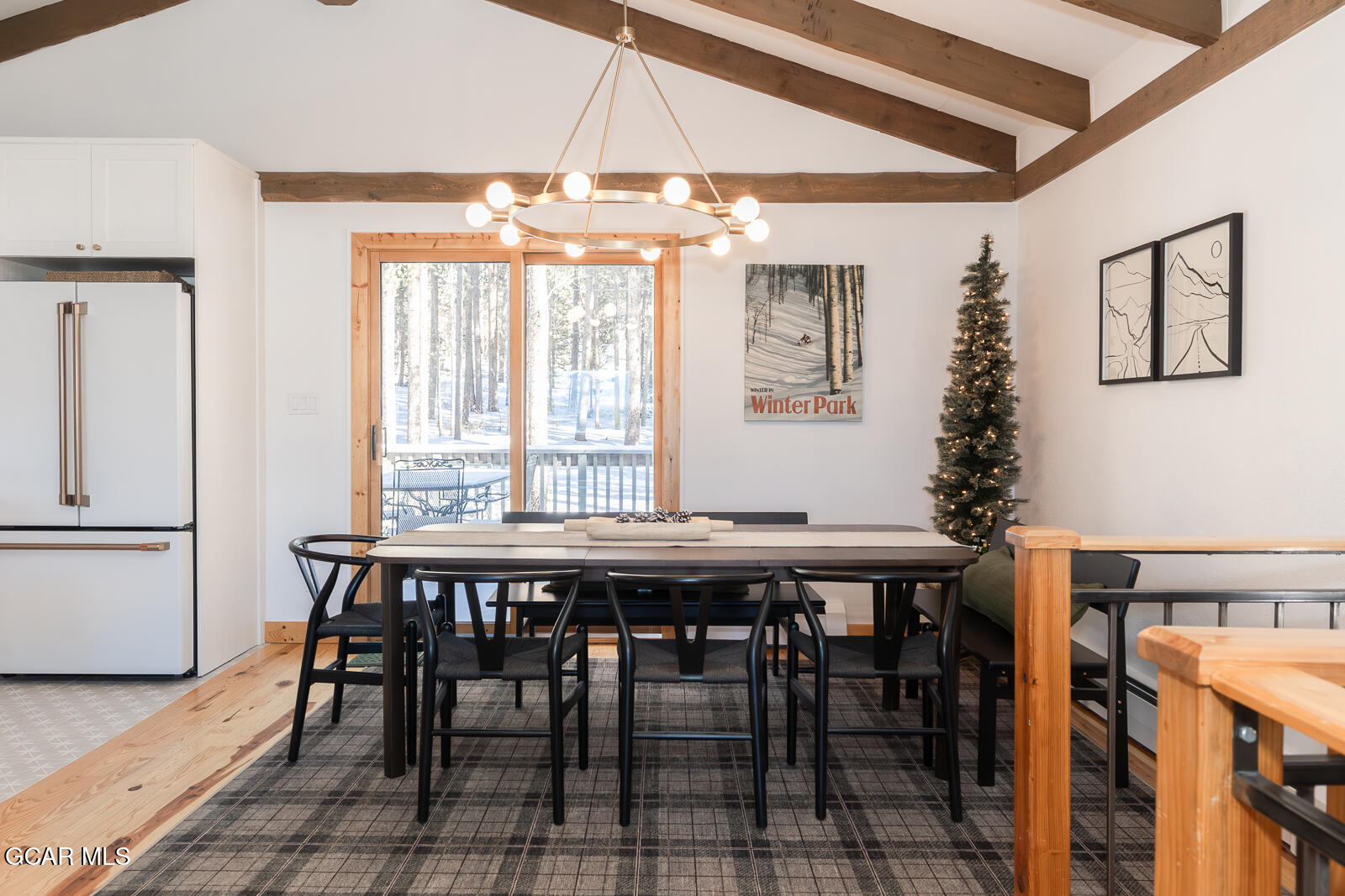 382 County Road 837 Fraser, CO 80442 - Photo 17 of 46 a dining room with wooden floor table and chairs