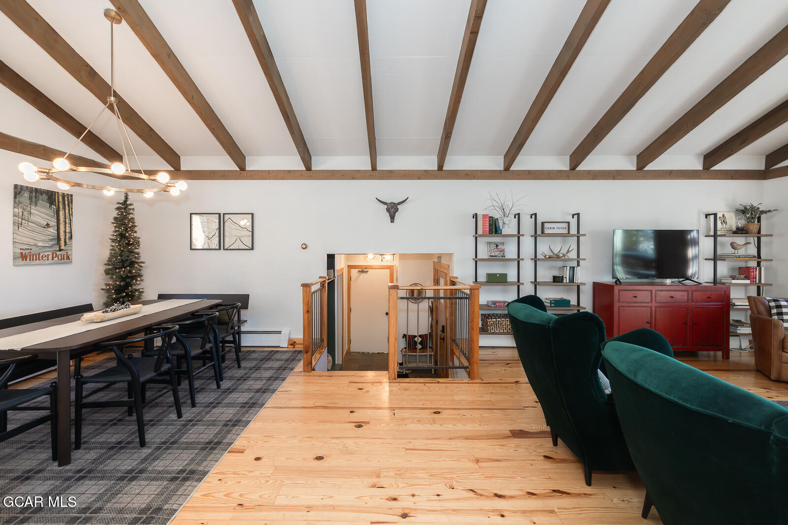 382 County Road 837 Fraser, CO 80442 - Photo 19 of 46 a living room with lots of furniture and wooden floors