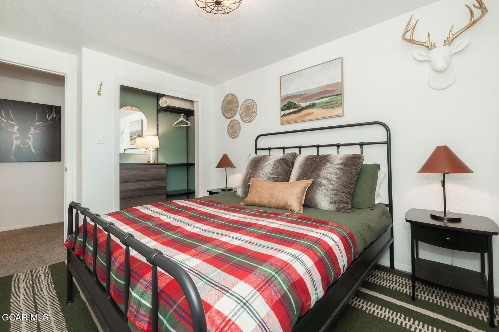 382 County Road 837 Fraser, CO 80442 - Photo 26 of 46 a bedroom with bed and a lamp