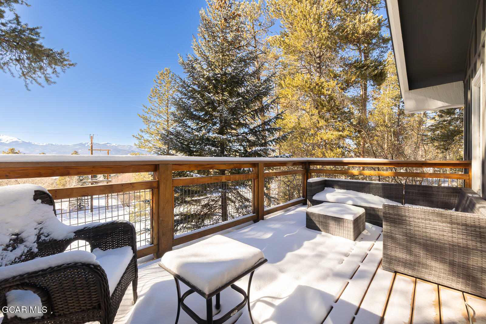 382 County Road 837 Fraser, CO 80442 - Photo 36 of 46 a balcony with wooden floor and outdoor seating