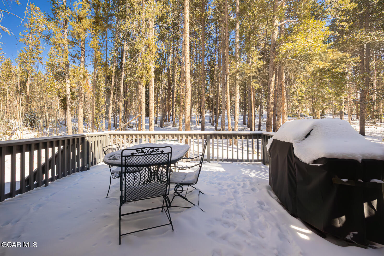 382 County Road 837 Fraser, CO 80442 - Photo 38 of 46 a balcony with a table and chairs