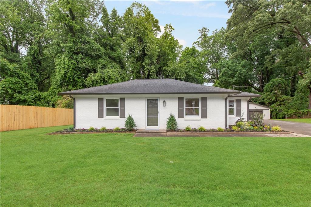 2260 Old Spring Road Smyrna, GA 30080 - Photo 1 of 29 a front view of house with a garden