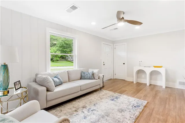 a living room with furniture and a window
