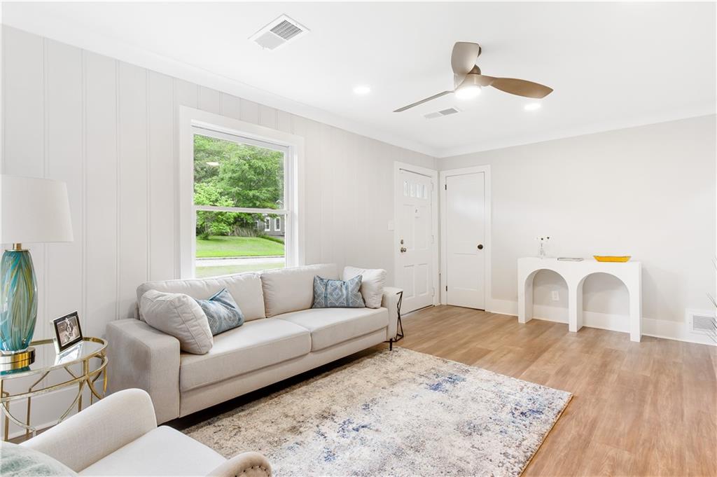 2260 Old Spring Road Smyrna, GA 30080 - Photo 11 of 29 a living room with furniture and a window