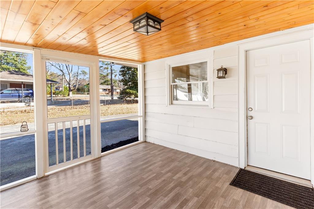 2260 Old Spring Road Smyrna, GA 30080 - Photo 15 of 29 an empty room with wooden floor and windows