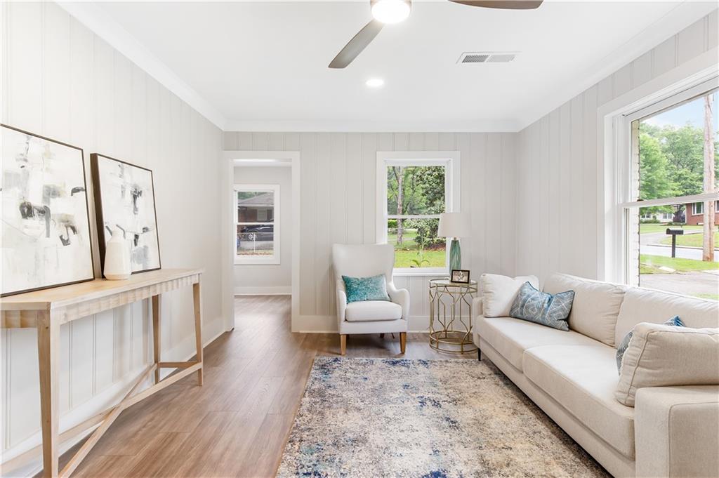 2260 Old Spring Road Smyrna, GA 30080 - Photo 2 of 29 a living room with furniture and a large window