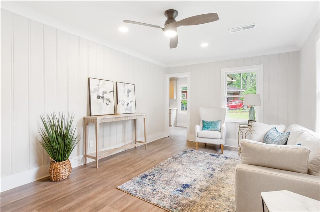 2260 Old Spring Road Smyrna, GA 30080 - Photo 8 of 29 a living room with furniture and a potted plant