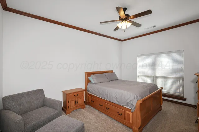 a bedroom with a bed and a couch in it