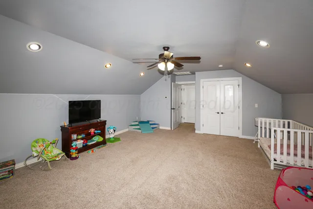 a livingroom with furniture and a flat screen tv
