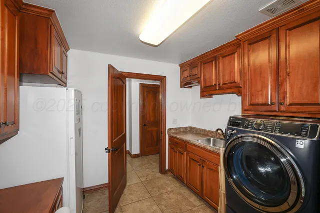 a view of a kitchen with washer and dryer