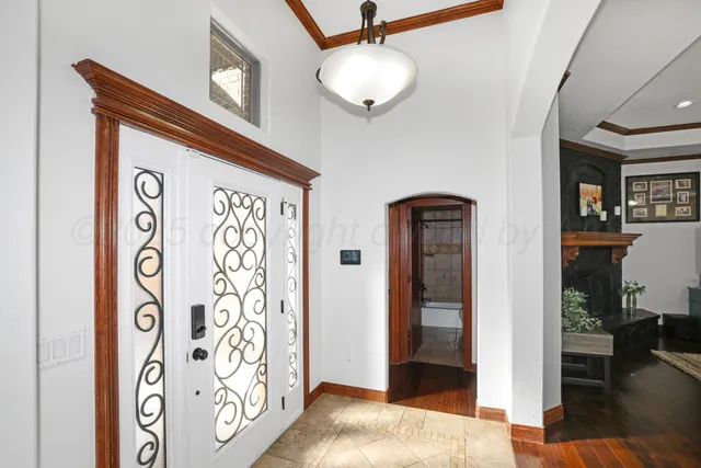 a view of front door with wooden door