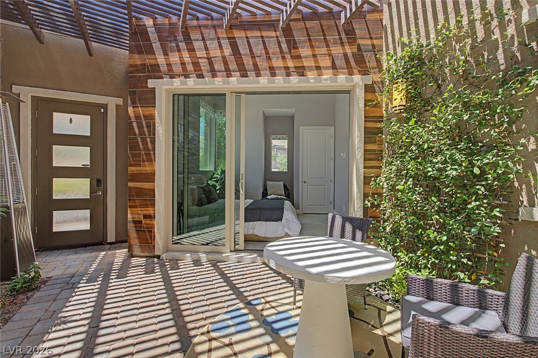 6014 Willow Ridge Court Las Vegas, NV 89135 - Photo 9 of 99 This private patio area offers a seamless indoor-outdoor living experience.