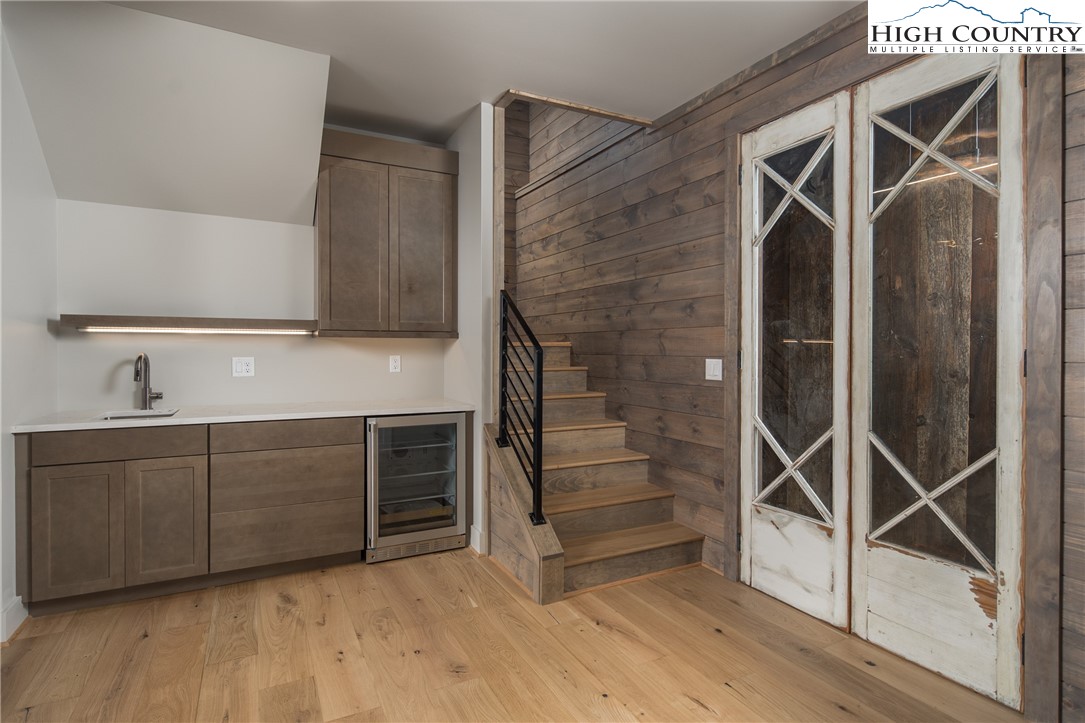 371 Ninebark Road Boone, NC 28607 - Photo 24 of 41 a view of an empty room with wooden floor and a window