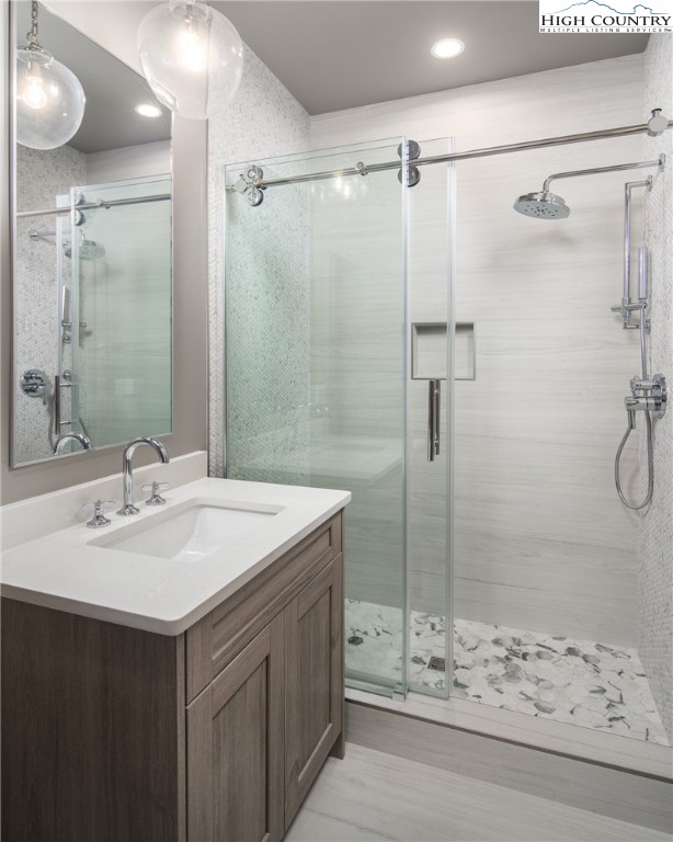 371 Ninebark Road Boone, NC 28607 - Photo 30 of 41 a bathroom with a sink shower and a mirror