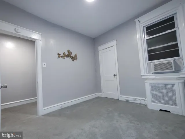 a view of a big room with closet and wooden floor