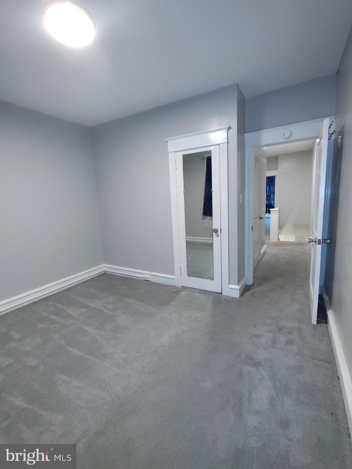 232 Copley Road Upper Darby, PA 19082 - Photo 15 of 21 a view of a big room with closet and wooden floor