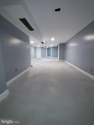 a view of empty room with a fireplace