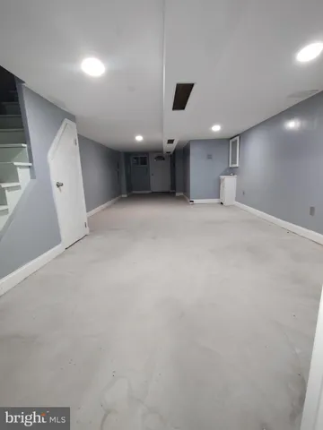 a bathroom with a toilet sink and shower