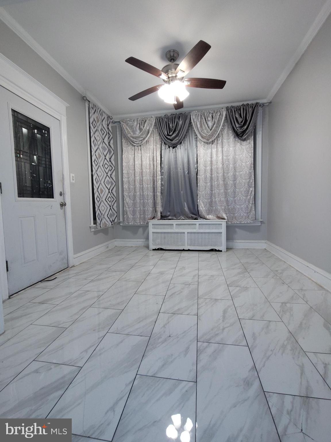 232 Copley Road Upper Darby, PA 19082 - Photo 2 of 21 a view of a livingroom with furniture and chandelier fan