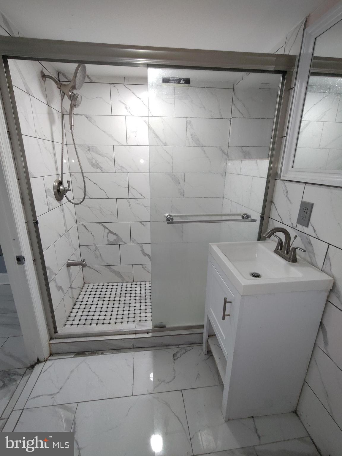 232 Copley Road Upper Darby, PA 19082 - Photo 21 of 21 a bathroom with a sink and a shower