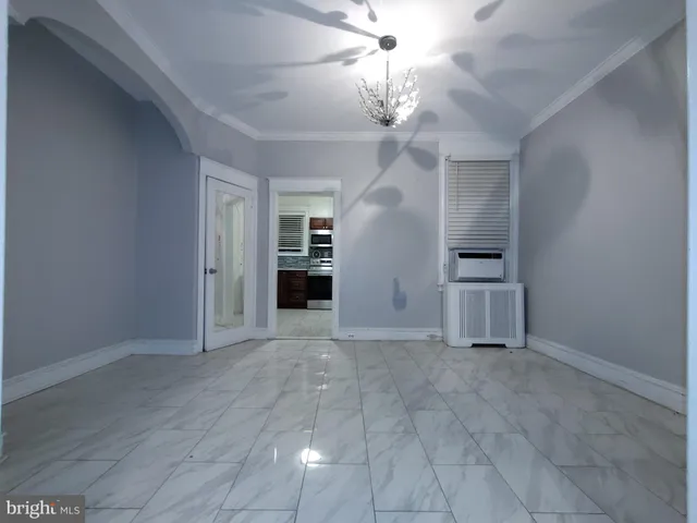 a large kitchen with stainless steel appliances granite countertop a stove and a sink